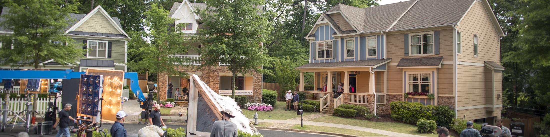 Crew on set outside in a cul-de-sac with three houses in Georgia to promote listing your Georgia property as a potential filming location