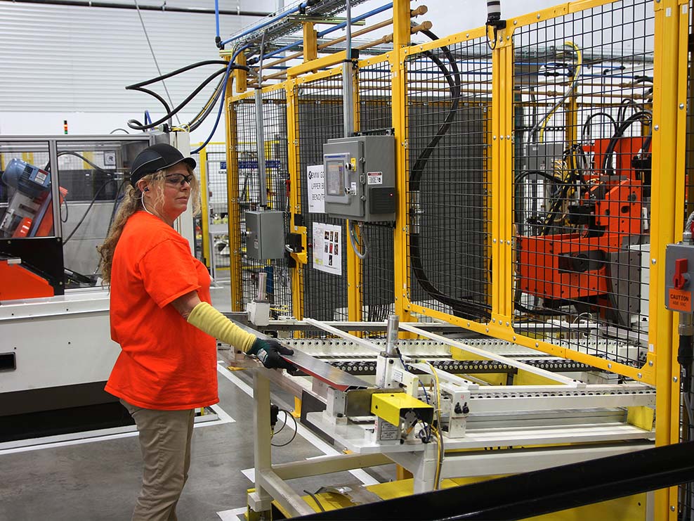 person works on large machine