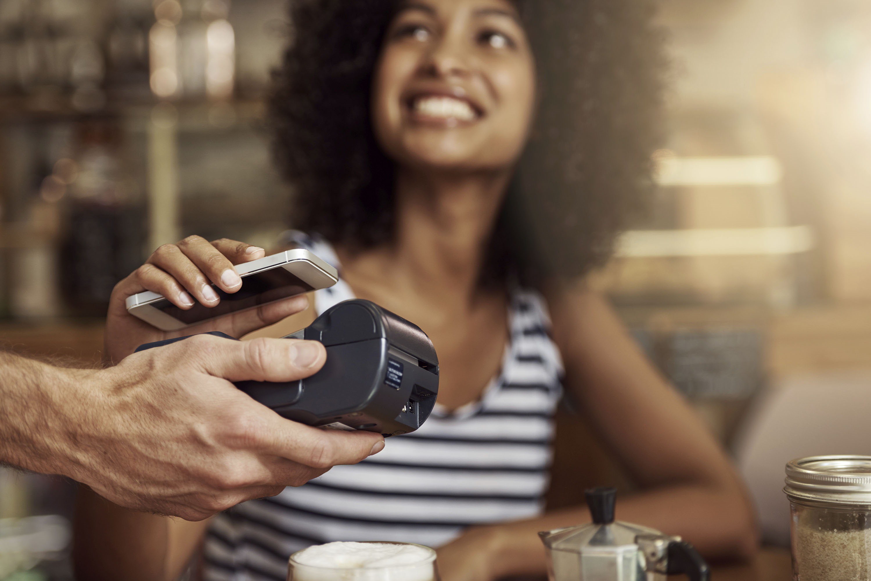 Woman paying with phone