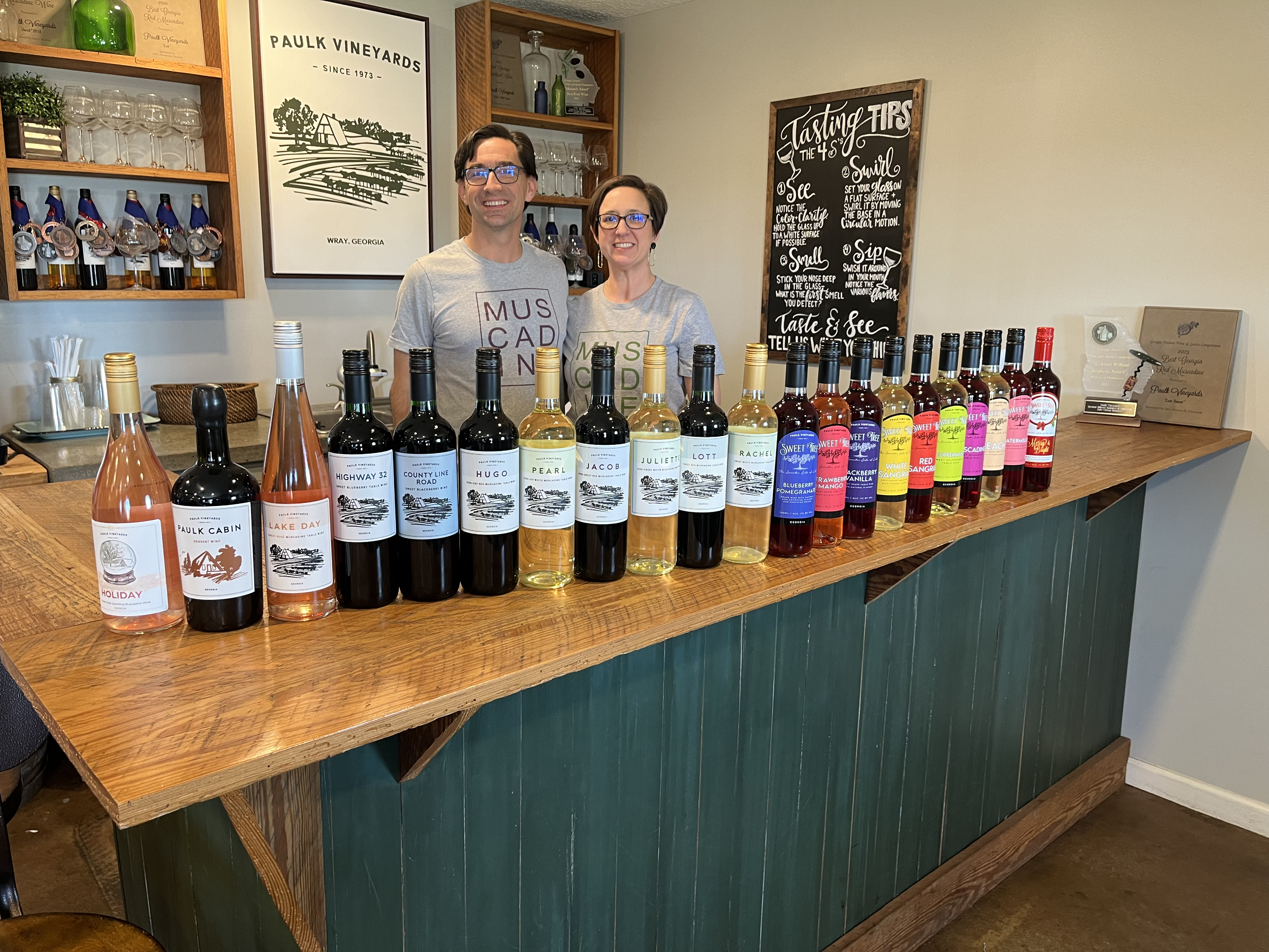 Chris and Jorjanne Paulk Vineyards Tasting Room with a bar lined with wine bottles