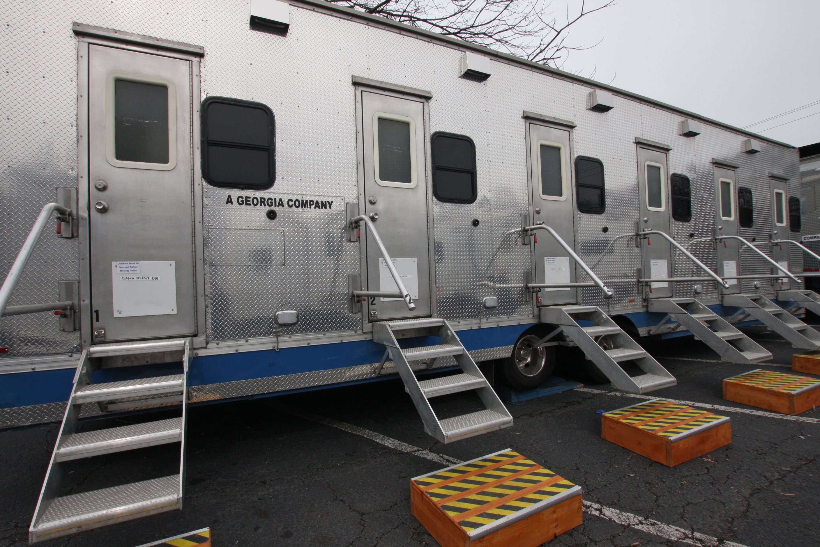 A film set tailer reads "A Georgia Company" on the side