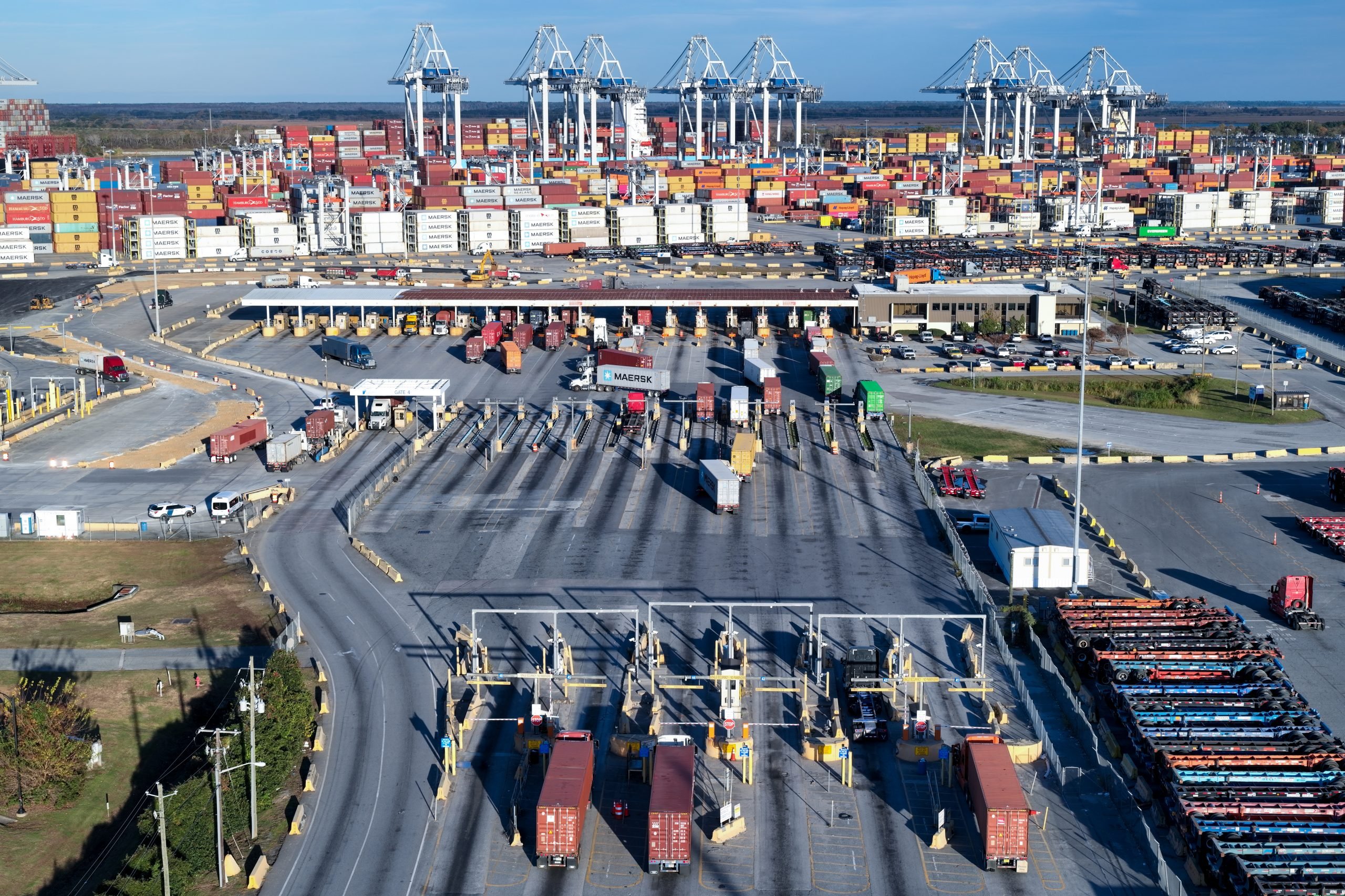 Trucks and shipping containers viewed from above at the bustling Port of Savannah