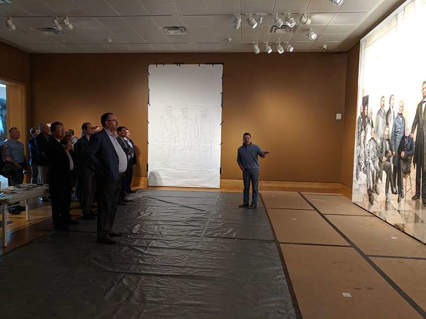 Artist Ross R. Rossin speaks during the VIP Tour visit to The Booth Museum