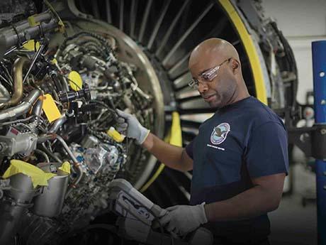 man works on turbine