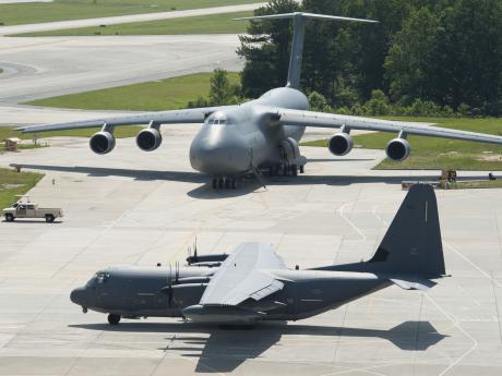 Two gray United States Air Force planes parked in a lot in Georgia