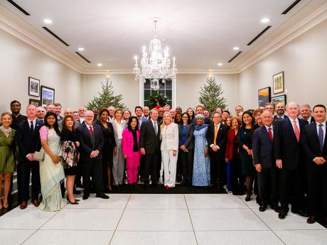 Seasons of International Cheer Governor Kemp and First Lady standing alongside members of the Consular Corp at the Governor's Mansion