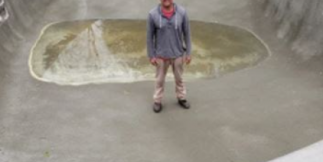 man swimming in underground swimming pool