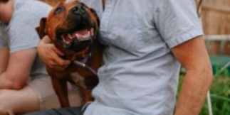 steve dietl holding dog on photoshoot