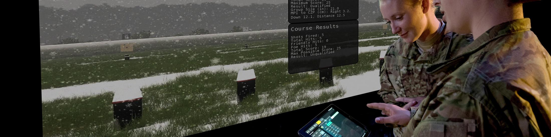 Soilders review targeting data in a defense facility.