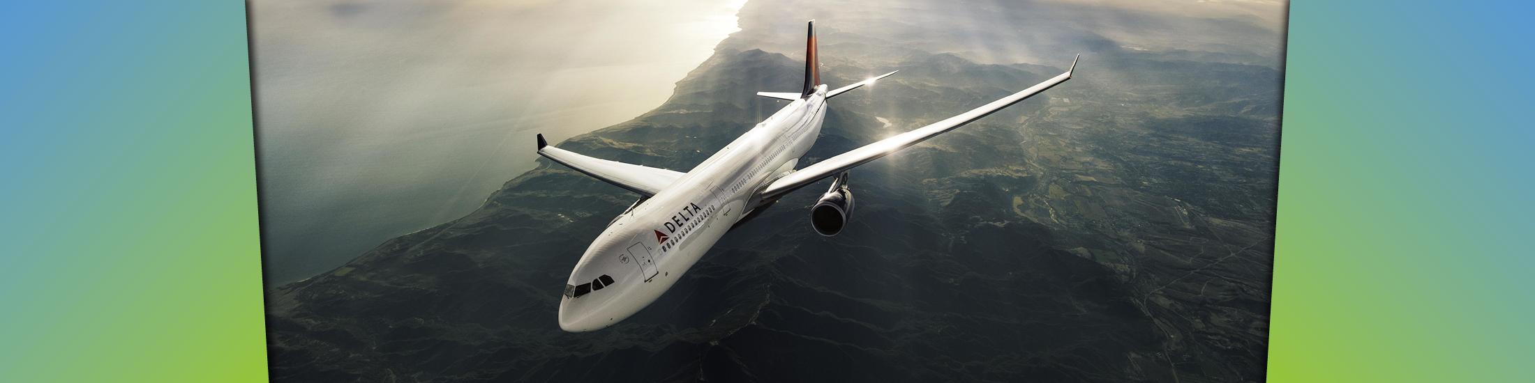 A plane flies across the sky above Georgia with the sun shining in the background.