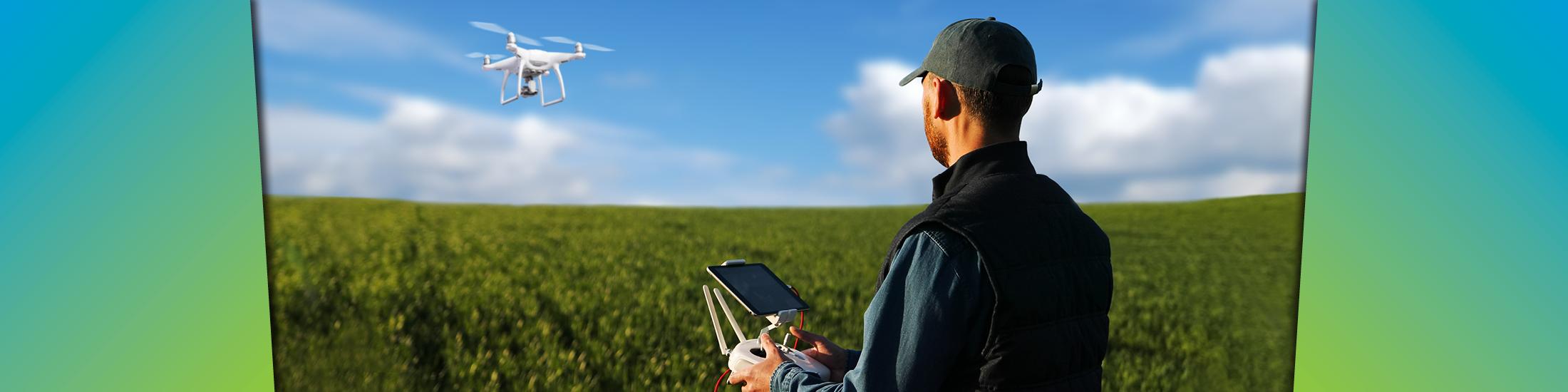 farmer with a drone over a field